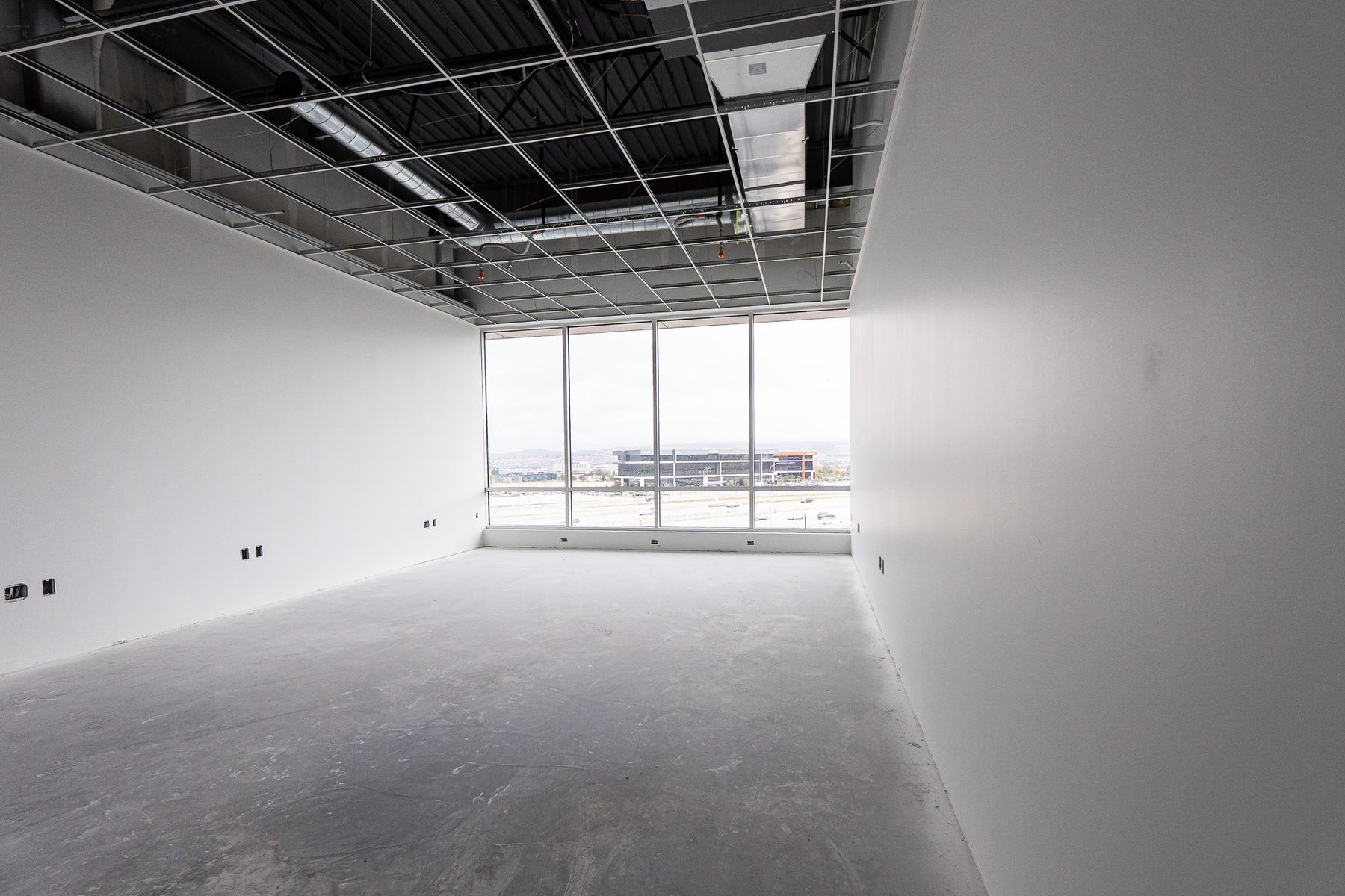 Long office with a window wall at the far end