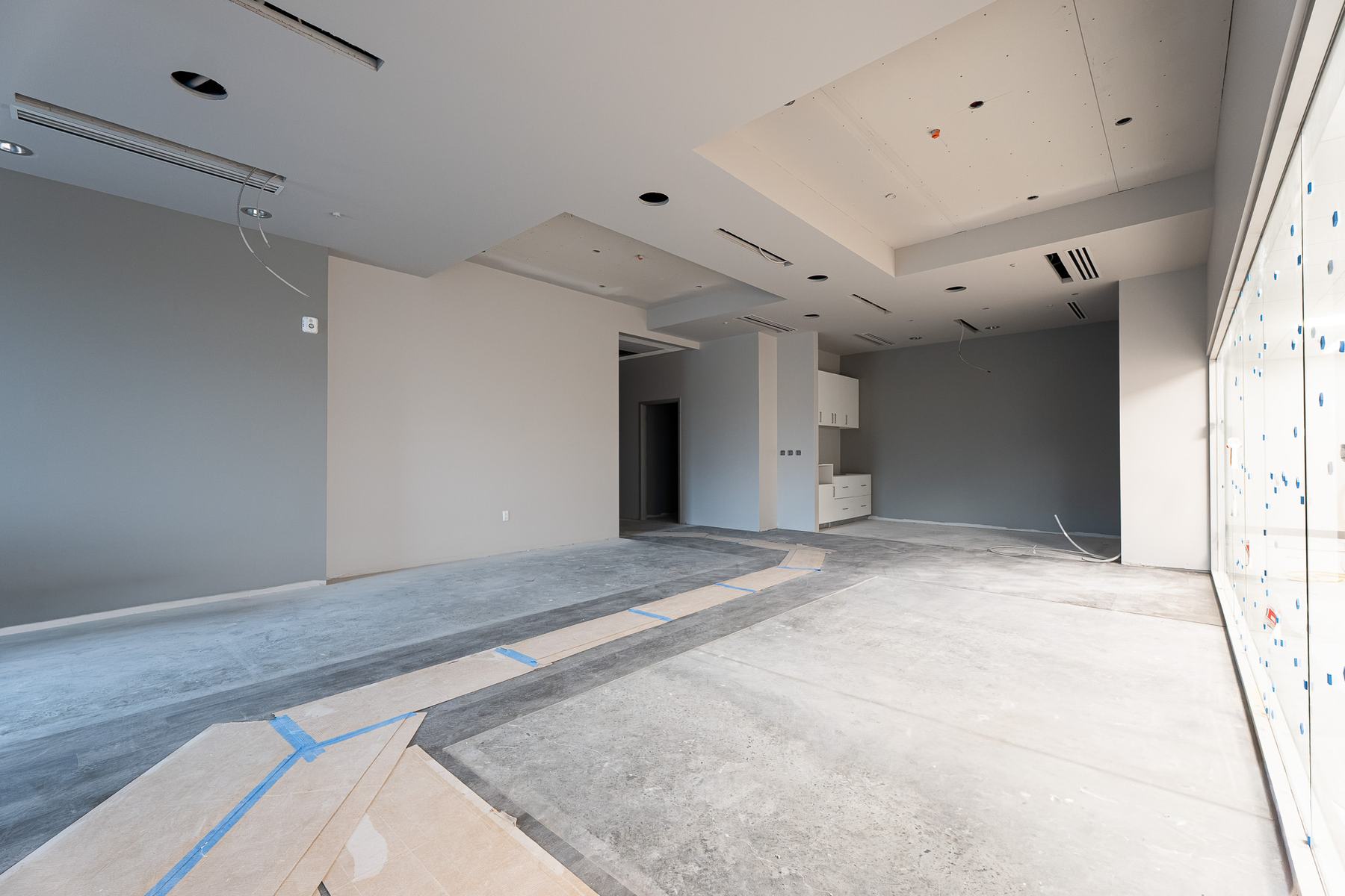 Suite with dropped ceilings and built-in cabinetry