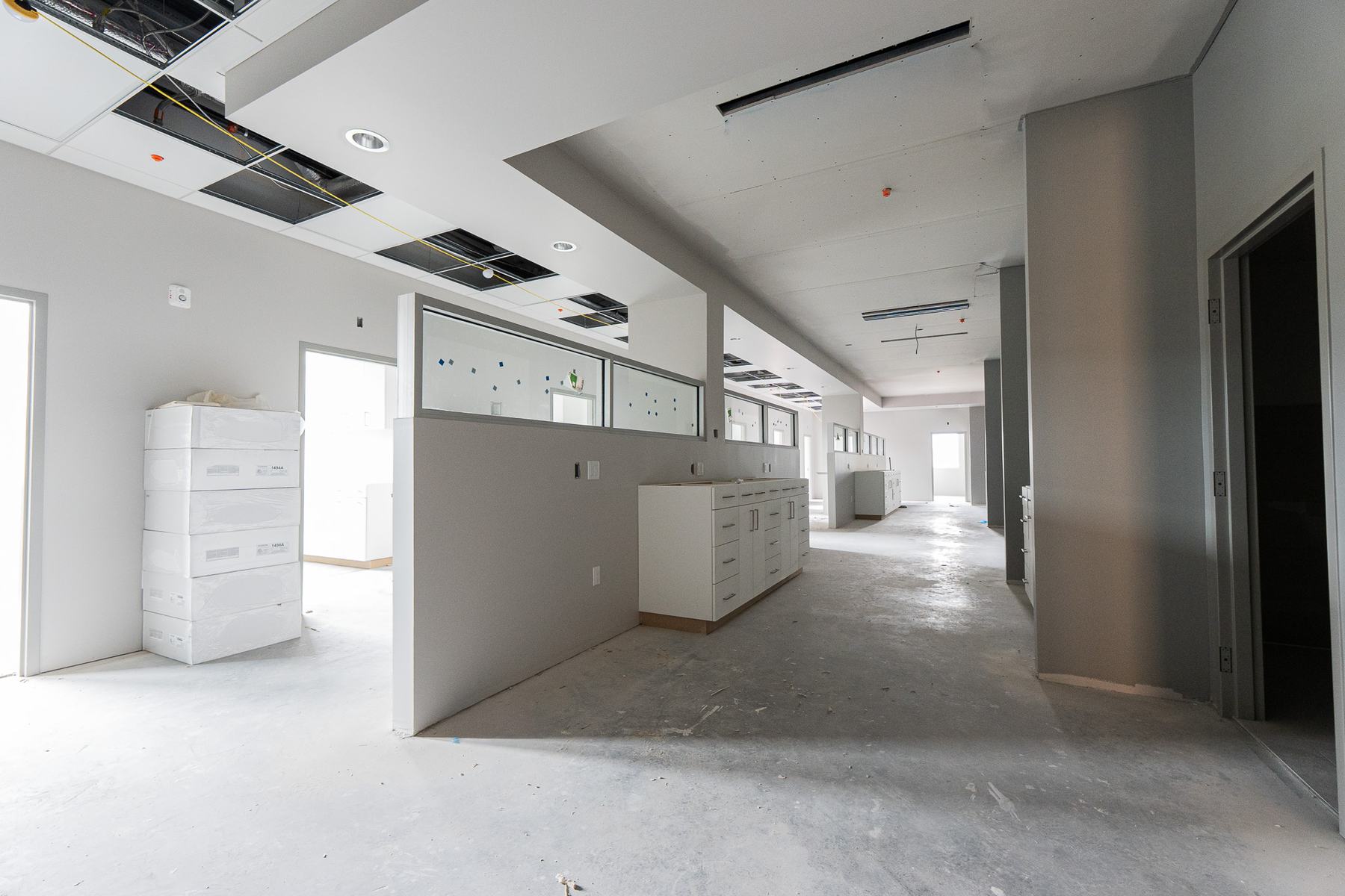 Corridor lined with rooms and built-in cabinets
