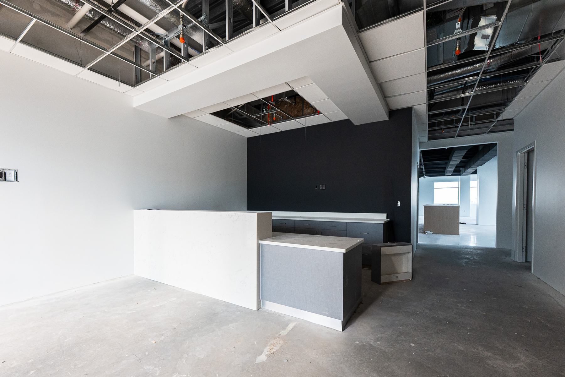 Reception desk with a dark accent wall